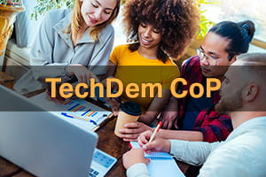 Click here to explore the TechDem CoP. Image: A group of educators collaborating. 