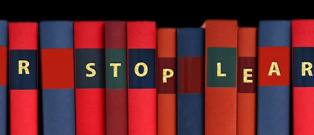 A series of books with 'never stop learning' written on their spines. Inspirational!